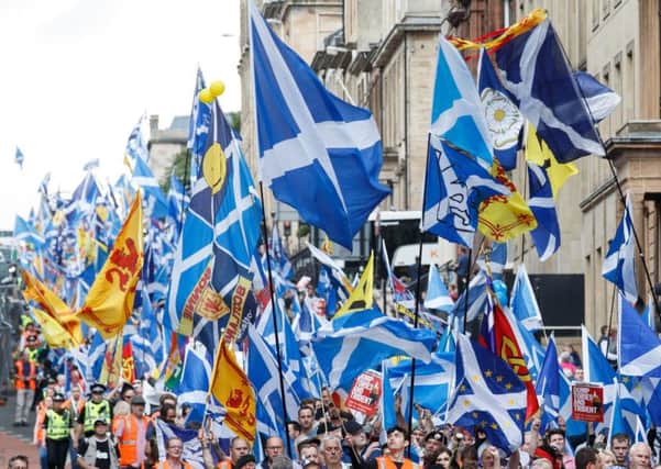 People taking part in the March for Independence wave Saltires as they process through Glasgow city centre. PRESS ASSOCIATION Photo. Picture date: Saturday June 3, 2017. Photo credit should read: Robert Perry/PA Wire
