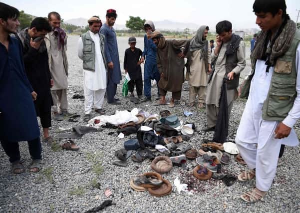 Afghans at the scene of the yesterdays attack. Picture: Getty