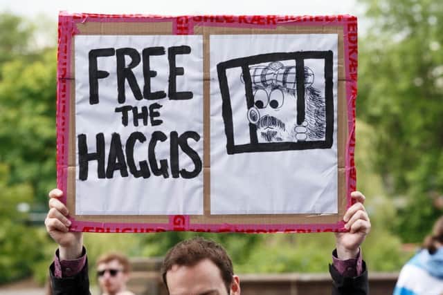 A man holds a banner saying "Free the haggis" as he takes part in the March for Independence. Picture: Robert Perry/PA Wire