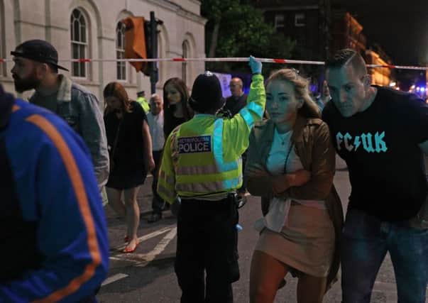 Police officers clear the area near Borough market at London Bridge. Picture: Getty