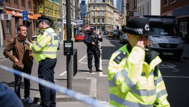 Police officers stand guard at the perimeter cordon, following Saturday night's London terror attack. Picture: Leon Neal/Getty Images)