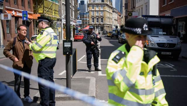 Police officers stand guard at the perimeter cordon, following Saturday night's London terror attack.  Picture: Leon Neal/Getty Images)