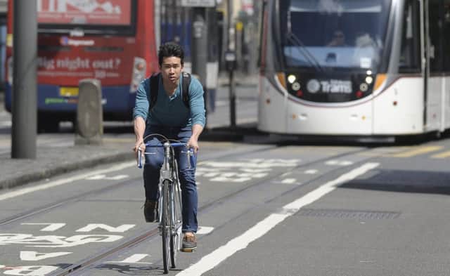 A cyclist heading East to West on Princes Street. Picture: Neil Hanna