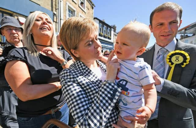 SNP leader Nicola Sturgeon holds a baby as she campaigns in Anstruther, Scotland. Picture: Jeff J Mitchell/Getty Images