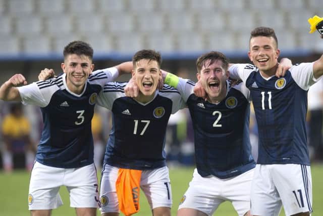 Left to right: Greg Taylor, Ruben Sammut, Anthony Ralston and Adam Frizzle celebrate Scotland's win over Brazil. Picture: SNS