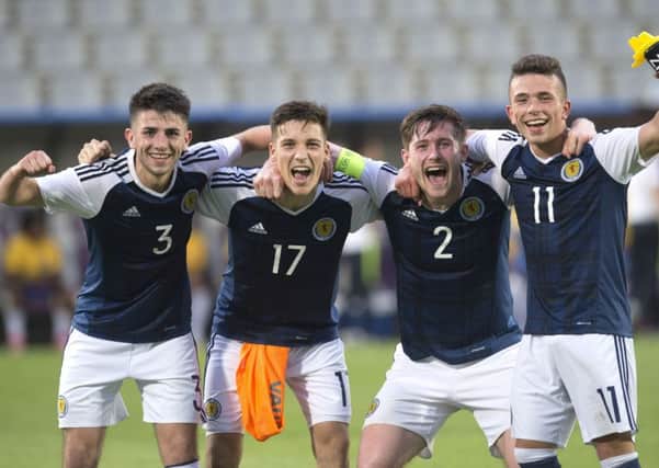 Left to right: Greg Taylor, Ruben Sammut, Anthony Ralston and Adam Frizzle celebrate Scotland's win over Brazil. Picture: SNS