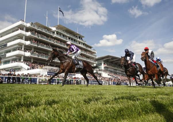 Wings Of Eagles, left, wins The Investec Derby from Cliffs Of Moher, centre, at Epsom. Picture Alan Crowhurst/Getty Images