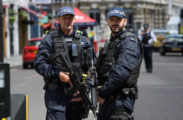 LONDON, ENGLAND - JUNE 04: Armed police officers stand guard at the perimeter cordon, following Saturday's London terror attack. Picture: Leon Neal/Getty Images