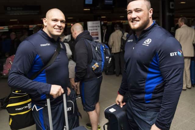 Scotland's Gordon Reid, left, and Zander Fagerson check in at Edinburgh Airport prior to flying out to Singapore. Picture: SNS/SRU