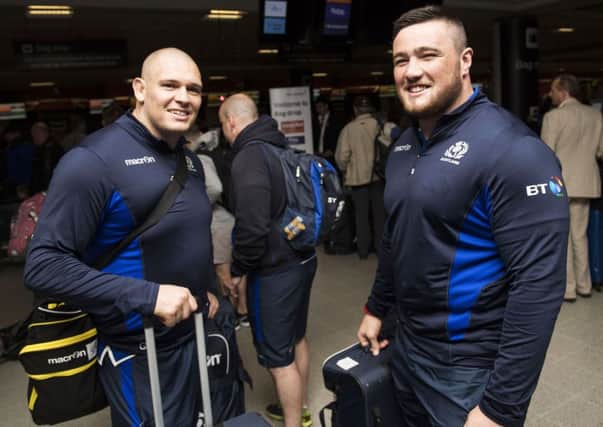 Scotland's Gordon Reid, left, and Zander Fagerson check in at Edinburgh Airport prior to flying out to Singapore. Picture: SNS/SRU