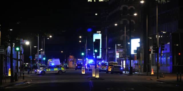 Police officers cordon off the area around London Bridge, central London, after reports of pedestrians being hit by a white van on London Bridge in London. Picture: Behlul Cetinkaya/Anadolu Agency/Getty Images