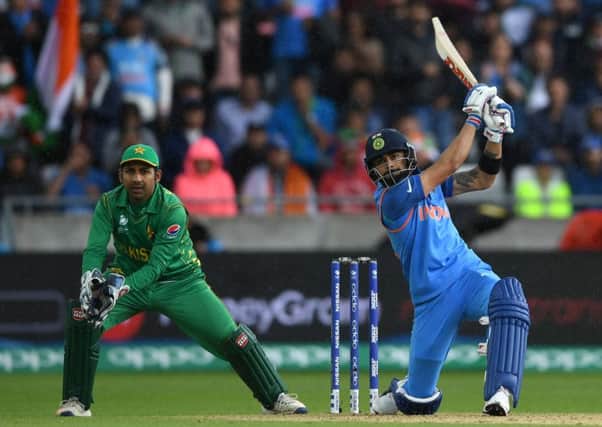 Virat Kohli hits out on his way to an unbeaten 81 in India's Champions Trophy win over Pakistan at Edgbaston. Picture: Gareth Copley/Getty Images