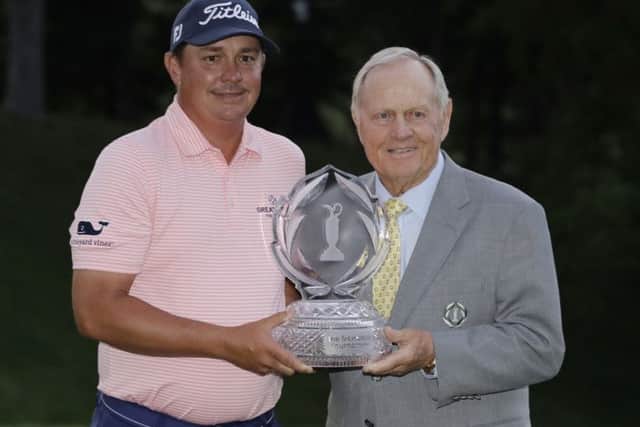 Jason Dufer receives the trophy from host Jack Nicklaus after winning the Memorial Tournament in Ohio. Picture: Getty Images