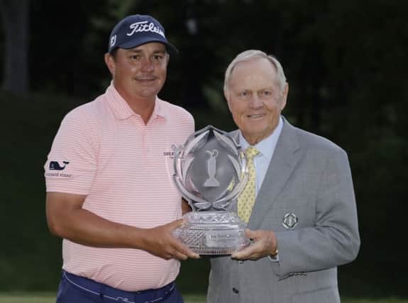 Jason Dufer receives the trophy from host Jack Nicklaus after winning the Memorial Tournament in Ohio. Picture: Getty Images