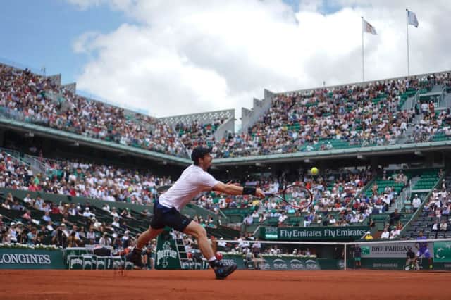 Andy Murray returns the ball to Russia's Karen Khachanov during their match at Roland Garros. Picture: AFP/Getty