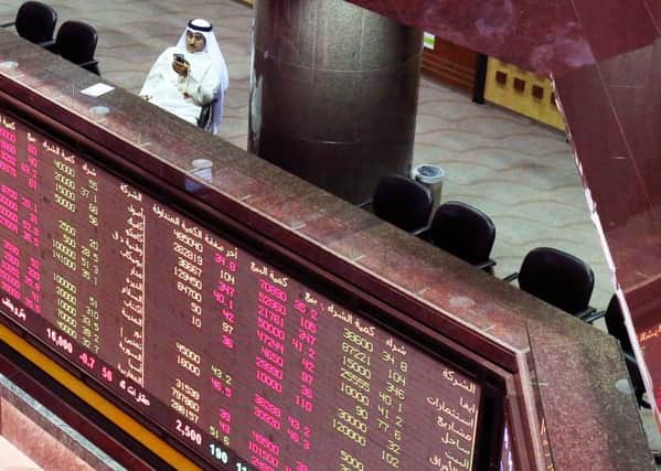 A Kuwaiti trader follows the stock market at the Kuwait Stock Exchange (KSE) in Kuwait City. Picture: Getty