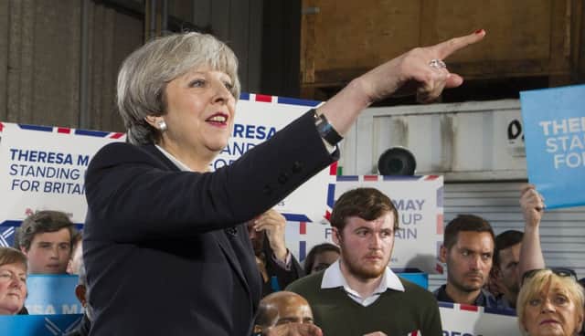 Prime Minister Theresa May joined Scottish Conservative leader Ruth Davidson on the campaign trail at Clockwork Removals in Edinburgh. Picture: SWNS