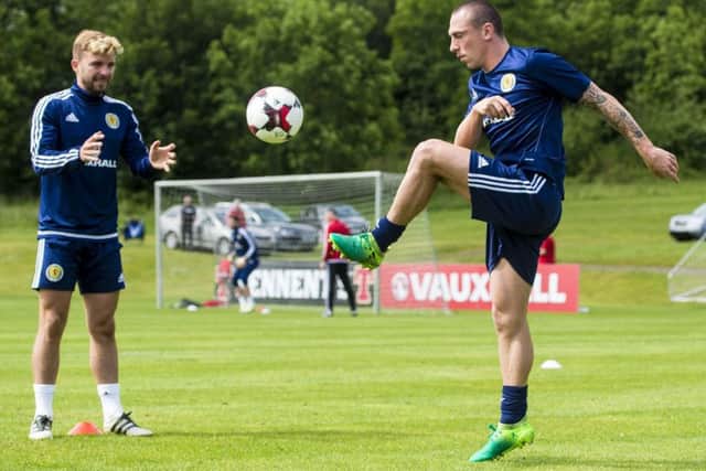 Scotland captain Scott Brown knocks the ball to James Morrison during training at Mar Hall. Picture: Craig Williamson/SNS