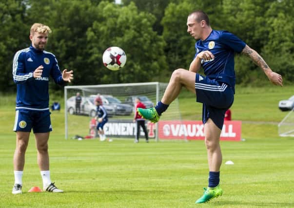 Scotland captain Scott Brown knocks the ball to James Morrison during training at Mar Hall. Picture: Craig Williamson/SNS