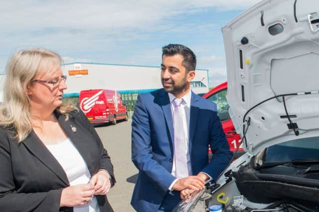 Fiona Deas with Humza Yousaf, who said he was 'encouraged by Eagle Couriers' green ethos'. Picture: Ian Georgeson