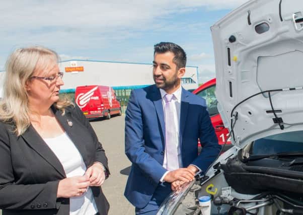 Fiona Deas with Humza Yousaf, who said he was 'encouraged by Eagle Couriers' green ethos'. Picture: Ian Georgeson