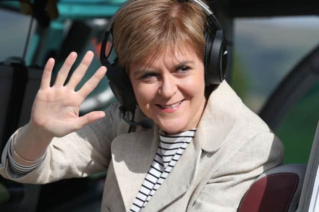 First Minister and SNP leader Nicola Sturgeon boards a helicopter - dubbed the 'Nicolopter' - in Cumbernauld. Picture: Andrew Milligan/PA Wire