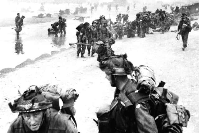 Allied troops arriving on a Normandy beach during the D-Day landings in June 1944. PIC: PA.