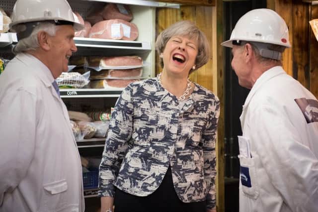Prime Minister Theresa May on a visit to Smithfield Market in the City of London on the final day of campaigning for Thursday's General Election. Picture: Stefan Rousseau/PA Wire