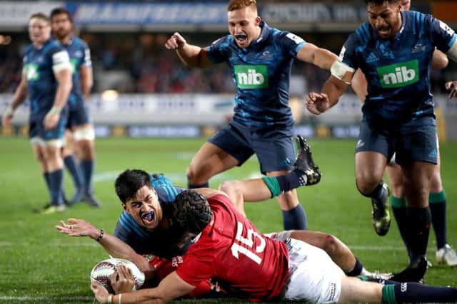 Rieko Ioane of the Blues celebrates what would eventually turn out to be a disallowed try. Picture: Getty