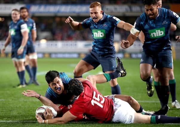 Rieko Ioane of the Blues celebrates what would eventually turn out to be a disallowed try. Picture: Getty