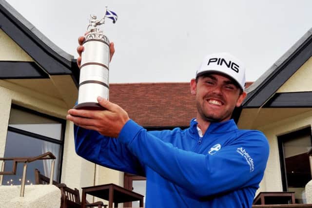 Liam Johnston with the Scottish Open Stroke Play trophy.