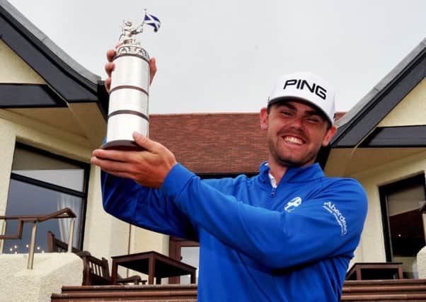 Liam Johnston with the Scottish Open Stroke Play trophy.