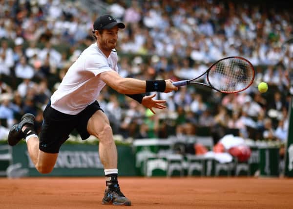 Andy Murray stretches to return the ball to Japan's Kei Nishikori during their French Open quarter-final on Court Philippe Chatrier. Picture: AFP/Getty Images