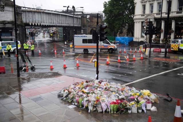 Flowers are pictured near a police cordon at the south-side of London Bridge, near Borough Market, placed in memory of the victims of the June 3 terror attacks. Picture: JUSTIN TALLIS/AFP/Getty Images