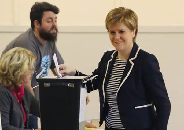 First Minister Nicola Sturgeon casts her vote in the General Election. Picture: Andrew Milligan/PA Wire