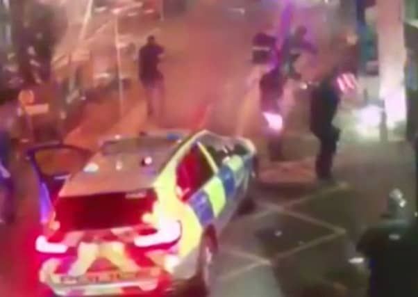 Still from a video which shows police as they surround an attacker during the attack in Borough Market. Picture: AP