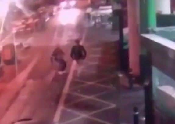 CCTV shows an attacker, left, just before stabbing a victim during the terror attack in Borough Market in London. Picture: AP
