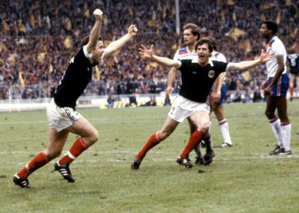 Scotland's John Robertson celebrates his penalty winner against England in 1981 with teammate Ray Stewart. Picture: SNS
