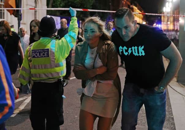 Members of the public who had been enjoying a night out are led away from the scene of the London terror attack last weekend.