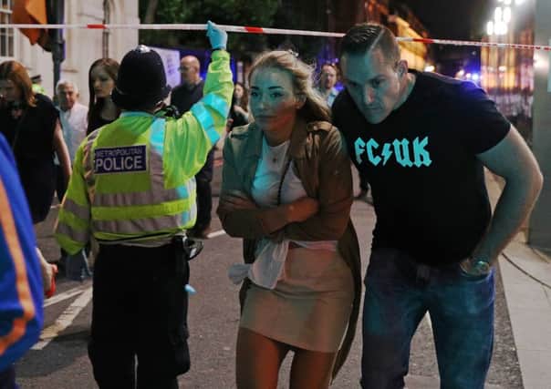 Members of the public who had been enjoying a night out are led away from  the scene of the London terror attack last weekend.