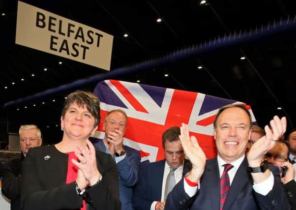 DUP deputy leader Nigel Dodds and leader Arlene Foster celebrate Dodds winning his Belfast North seat. Picture: Getty