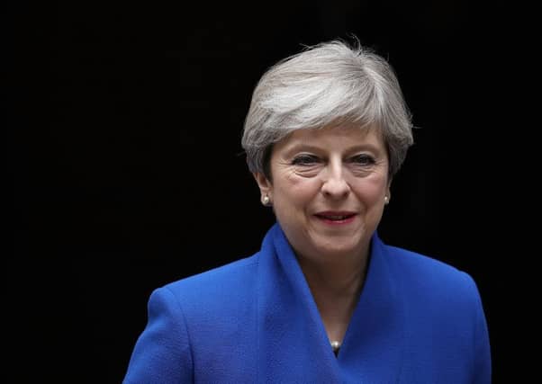 Theresa May leaves Downing Street to see the Queen. Picture: Getty Images