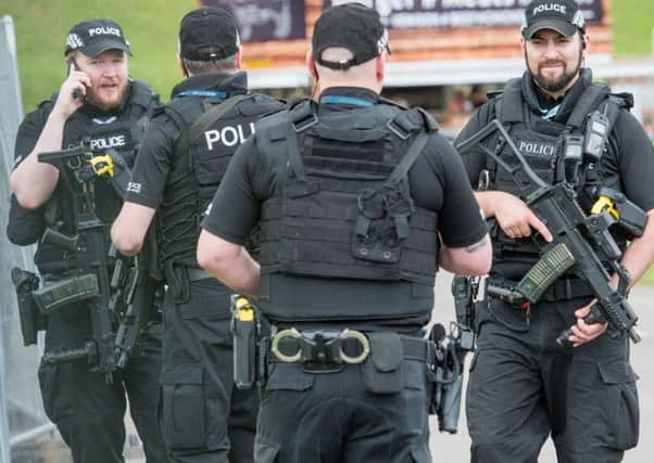 Armed police patrol the grounds of Murrayfield stadium. Picture: Ian Georgeson