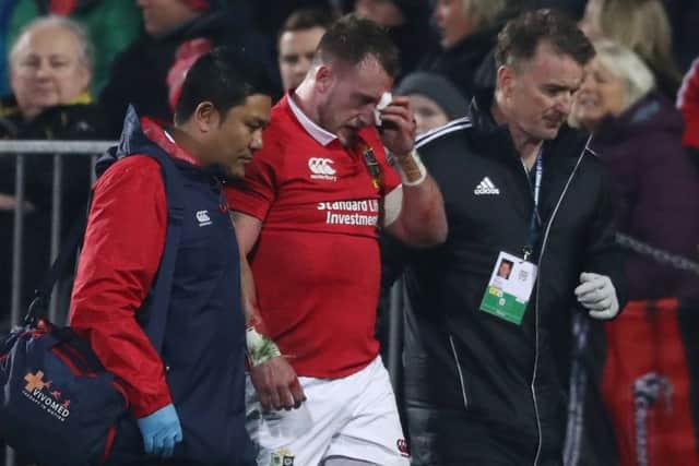Stuart Hogg is helped off the pitch after an accidental collision with Conor Murray. Picture: David Rogers/Getty Images