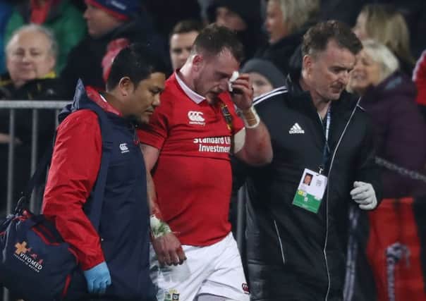 Stuart Hogg is helped off the pitch after an accidental collision with Conor Murray. Picture: David Rogers/Getty Images