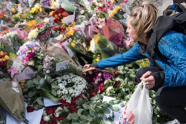 A woman lays flowers near the scene of Saturday's terrorist attack, on June 6, 2017 in London. Picture; Getty
