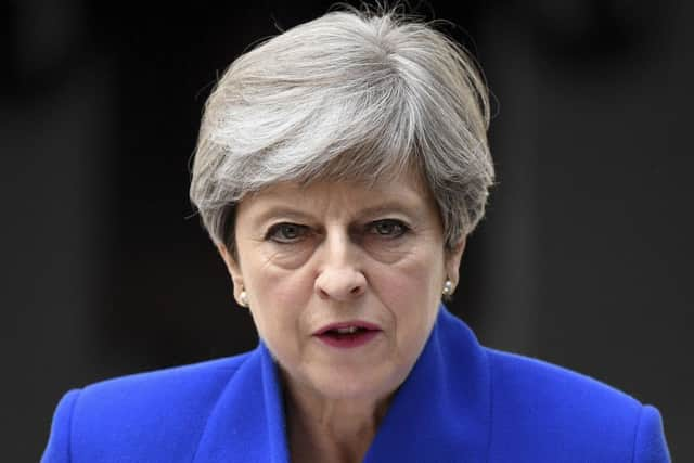 Prime Minister Theresa May speaks outside 10 Downing Street after returning from Buckingham Palace. Picture; Getty