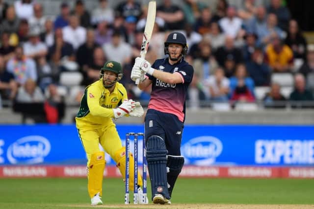 Wicketkeeper Matthew Wade can only look on as Englands Eoin Morgan lofts the ball for six.  Photograph: Getty Images