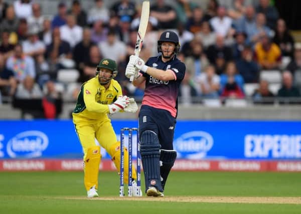 Wicketkeeper Matthew Wade can only look on as Englands Eoin Morgan lofts the ball for six.  Photograph: Getty Images