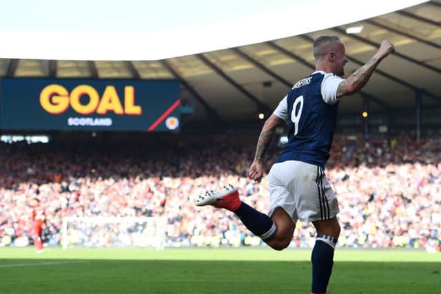 Leigh Griffiths celebrates after scoring Scotland's second goal. Picture: PAUL ELLIS/AFP/Getty Images